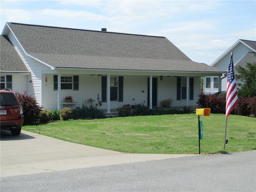 This lovely meticulously maintained home was custom built for current owner. Pride of ownership is evident in every space. You can live on main floor if you choose as it offers 3 bedrooms, 2 baths, open living/dining/kitchen along w/large laundry area. Split floor plan allows privacy.  Lower level has full bath, huge open space to configure as you please and patio access.. Large upper back deck has lake view & can be accessed from master suite as well as living room. Covered porch, tons of storage  space.