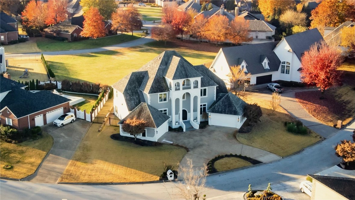 An exceptional opportunity awaits in the prestigious Pinnacle Country Club Subdivision. No detail has been overlooked in this 5,858 sf home that sits on a .37-acre lot and offers a third level, panoramic golf course view. New roof March 2024. With 5 beds and 4/2 baths. Step inside to natural light that pours through the double-height ceilings, featuring an executive office, and a grand staircase. An open concept design, blending spaciousness with style, creating a truly remarkable living experience. The kitchen is equipped with an oversized island, waterfall countertops, white cabinetry, and top-of-the-line appliances. The primary suite offers 2 boutique-style walk-in closets and a spa bathroom with a large soaking tub. Upstairs, a lounge area, wet bar, and 4 en-suite bedrooms with incredible views await you. Outside, you'll find a private entertainer's backyard with a saltwater pool, pool house, waterfall, built-in BBQ, and beautifully landscaped surroundings.