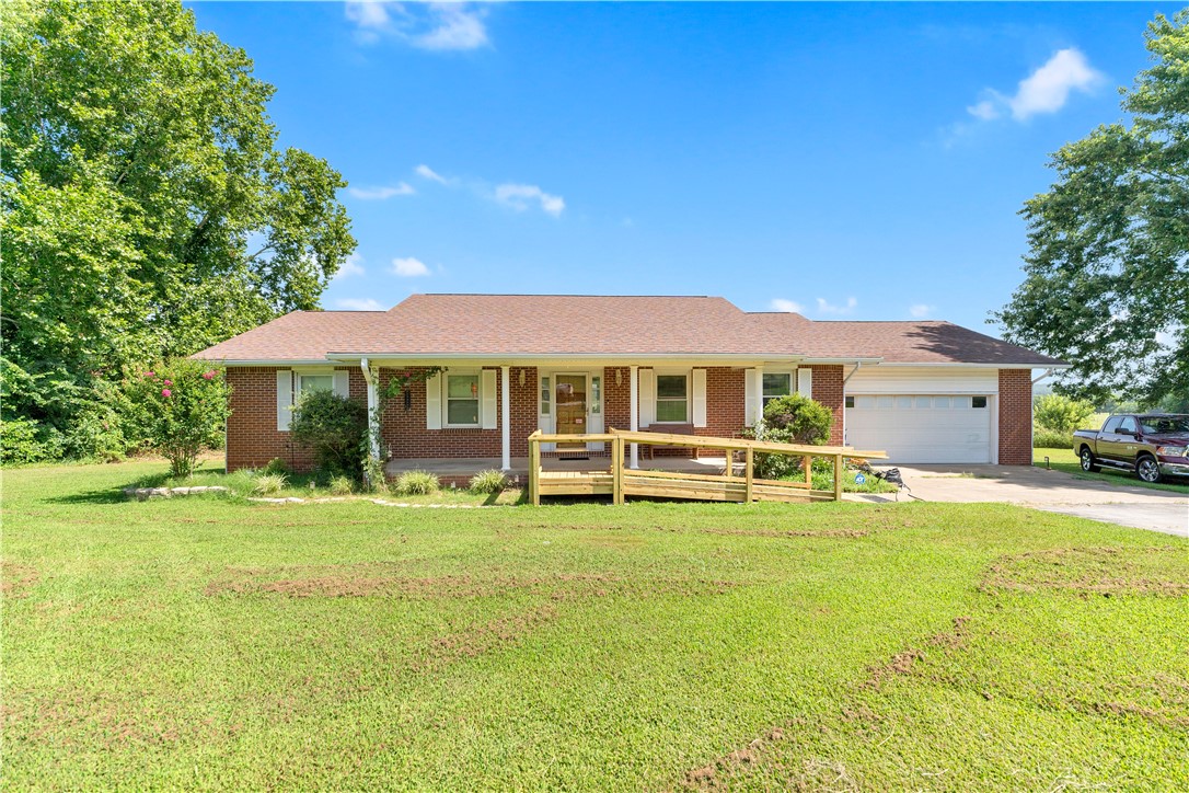 Welcome home to this beautifully maintained **3-bedroom, 1.5-bath** home in the heart of Prairie Grove! Pride of ownership is evident throughout, making this property truly move-in ready. One of the standout features is the **heated and cooled sunroom**, the perfect place to enjoy your morning coffee or unwind while taking in the peaceful views of the **Prairie Grove Battlefield**, which borders the backyard.

Conveniently located **directly across the street from Prairie Grove schools**, this home offers an ideal combination of comfort, convenience, and a one-of-a-kind setting steeped in local history. Whether you're looking for a quiet place to relax or easy access to schools and town amenities, this property has it all. Don't miss your opportunity to own this well-cared-for home with one of Prairie Grove's most scenic backdrops!