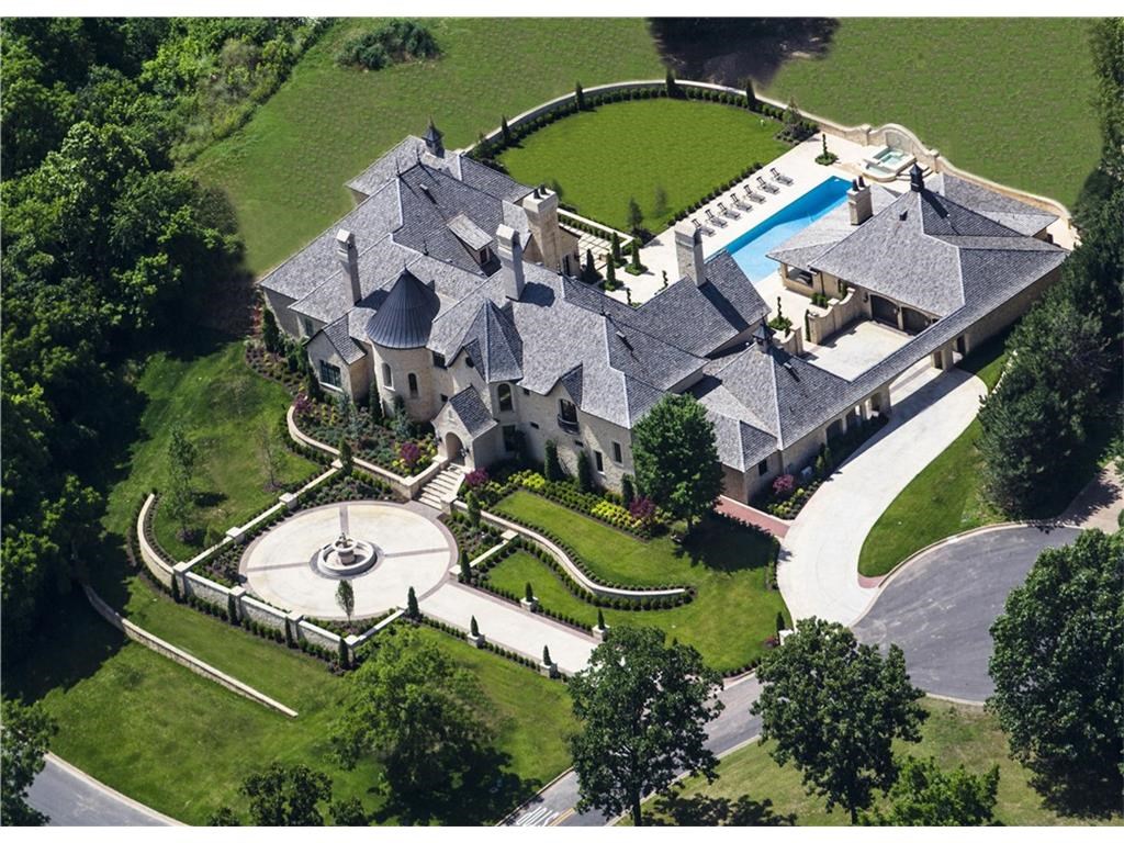 Truly a piece of France in Pinnacle Country Club, this palatial limestone estate blends delicate French grandeur w/21st-centry amenities. Some architectural elements include Amish beams, Tibetan temple hardwood floors, custom made French crystal chandeliers & Chateau cabinetry.  Property features 6 en suite bedrooms, elevator, grand reception rooms, theatre room, his/her private master bathrooms, wellness room, wine cellar, safe room, library & impeccable gardens w/a resort-style pool & pool house.
