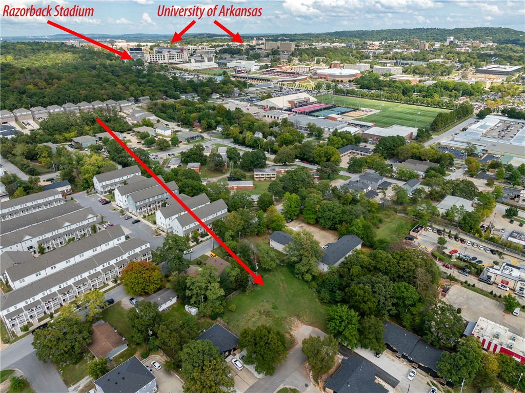 Multi-family Development Opportunity on the edge of the University Campus! 4 adjacent parcels of land less than half a mile from the University of Arkansas campus, shopping/dining entertainment district and only minutes from Dickson Street/Fayetteville Square! Zoned RMF-24, this land has the capability for 18-20 units ideal for student housing. Two parcels of land each have a 2 bedroom 900 Sq ft rental on them with leases in place but also carry short-term rental (STR) permits. The 3rd lot and 4th lots are cleared and available to develop.
