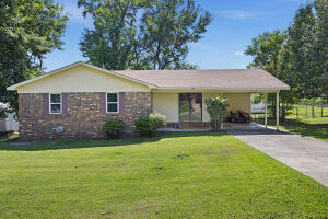 Comfort and convenience, this charming home features 3 bedroom, 1.5 bath with fenced in back yard and storage building. The home has undergone several updates to enhance its appeal & functionality. The windows have been replaced with modern, energy-efficient ones, allowing for an abundance of natural light to filter through while also improving insulation. The main bathroom has been beautifully remodeled, boasting contemporary fixtures and finishes that add a touch of luxury to daily routines.  As an added bonus, the property features a new hot water heater, ensuring a reliable supply of hot water for all your bathing, cooking, and cleaning needs.  Furthermore, the exterior of the home has been refreshed with new paint, giving it a vibrant and well-maintained appearance.