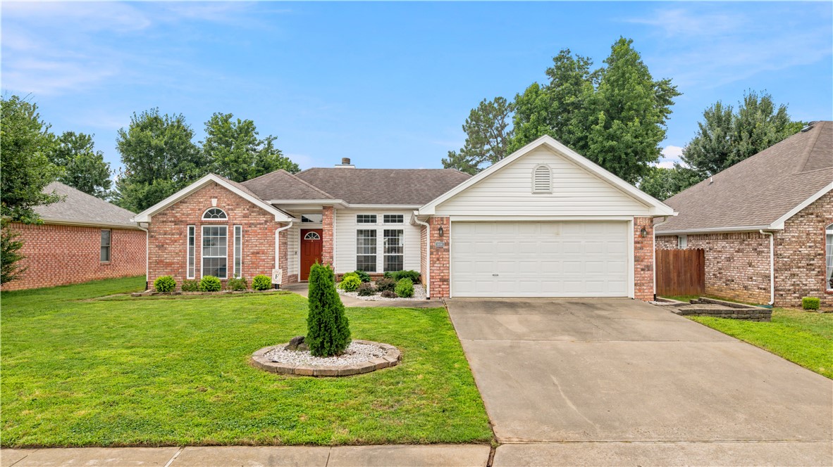 Conveniently located in Cambridge Park in the heart of NWA & close to shopping & restaurants.  This split-bedroom plan is perfect for a growing family or retirees and is move-in ready.  It boasts 3 bedrooms, 2 baths & and oversized garage.  The eat-in kitchen has been updated with stainless appliances, has abundant cabinets, under counter lighting & a great breakfast bar.  The living area with vaulted ceiling has built-in cabinets, wood flooring & a gas log fireplace.  The primary suite has a tray ceiling and the adjoining bath has a walk-in shower, soaking tub, double sinks, & double closets.  The house has been updated with an ECO thermostat.  A covered patio & large fenced back yard complete this one!