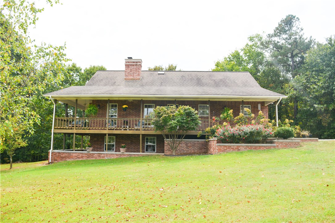 Country home in a gorgeous setting on over 4 acres of land with views of Illinois river valley. Large wrap around porch is perfect for enjoying the beautiful views and abundant wildlife. Detached 1200 sq ft shop is a perfect workshop space! Inside this home has a lot to offer. A sunroom provides a great space for enjoying the outdoors rain or shine! Living room features wood floors and floor to ceiling stone fireplace. Formal dining room with stone fireplace and large windows with wooded views.Eat-in kitchen has lots of natural light, large island, and brick accented gas stove. Formal living room with wood floors,bay window, and brick fireplace.Spacious master suite has large windows for enjoying the views, renovated master bath is the perfect retreat with walk-in shower and tub. Large basement provides lots of storage space.