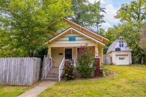 Welcome to this charming cottage-style 3BR, 1BA home, offering the perfect opportunity to personalize with a little TLC. Converting the upstairs into a classroom is a fantastic idea for providing a designated space for learning or it could easily serve as a 4th BR or home office. Additionally, the attic offers amplestorage space. The original hardwood floors add a touch of character and warmth to the home. The fenced yard ensures safety for small children and pets, while the garage with its second floor provides even more storage space. Conveniently located close to downtown square and Harrison shopping areas,yet peacefully nestled in a quiet neighborhood. Don't miss the chance to see it for yourself; come and check it out today!