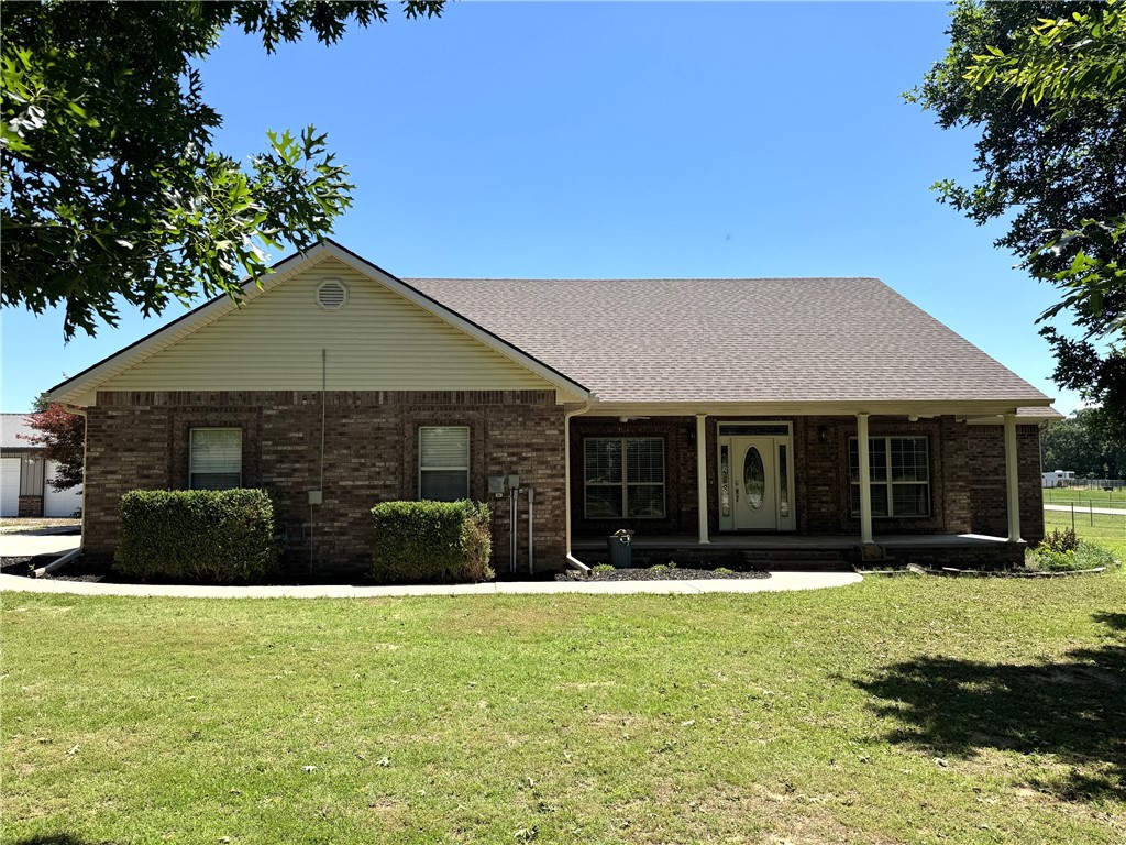 Rare find in Farmington on paved road close to town.  3 level acres plus a 2,179 sq. ft. brick home featuring 4 bedrooms, 2 baths, very good condition.  Home has a 2 car garage plus a detached 28x36 shop beside the house.  There is a super nice 40x80 metal shop with drive through doors and a built-in office in one corner.  Home has new paint and carpet, split bedrooms, double oven in kitchen, nice size utility room and a covered back porch. Also, solar panels that service all the buildings. Last year's average was $65/month. Enjoy the fenced backyard.