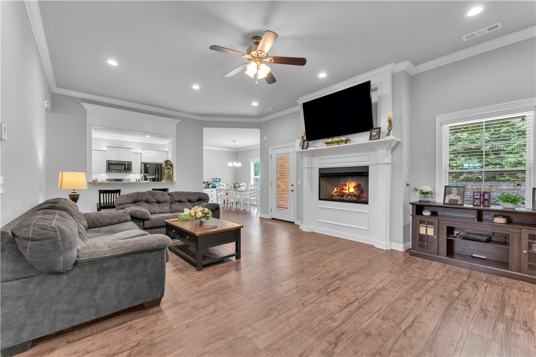 Welcome to this charming home in Sundowner Estates! Thoughtfully designed with a split floor plan and beautiful crown molding, this well-maintained two-owner home offers both comfort and style.

The kitchen features granite countertops, a gas range, a spacious pantry, and a large bar perfect for gatherings. The cozy living room, complete with a gas log fireplace, flows seamlessly into the kitchen, creating an inviting open-concept space.

Relax in the spacious primary suite featuring an oversized closet, double vanities, and a walk-in glass shower. Additional highlights include a finished garage with a sealed floor—adding both durability and functionality—and a built-in security system for added peace of mind.