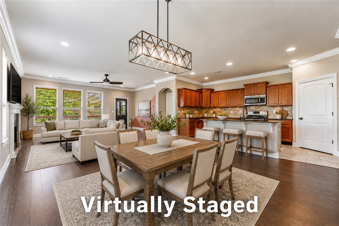 Welcome to The Hamptons—a charming neighborhood near Mt. Hebron Park & the premier shopping, dining, & entertainment of Pinnacle Hills.
This all-brick & stone 4-bedroom, 2.5-bath home sits across from the half-acre park offering extra room to play without the upkeep.
Two living areas provide flexibility for entertaining, relaxing, or working from home. The open-concept kitchen showcases a pantry, abundant workspace, and seamless flow into the family room with a cozy gas fireplace. With 2 bedrooms on the main level & 2 upstairs, the layout is ideal for guests, family, or a home office setup.
Spacious closets throughout provide exceptional storage. Outdoor living is equally impressive with a covered front porch, private upstairs balcony, a partially covered back patio/ deck, & plenty of yard space with a privacy fence.
If you’ve been searching for timeless curb appeal, a versatile floor plan, and a prime location in one of Northwest Arkansas’ most desirable areas, this home delivers.