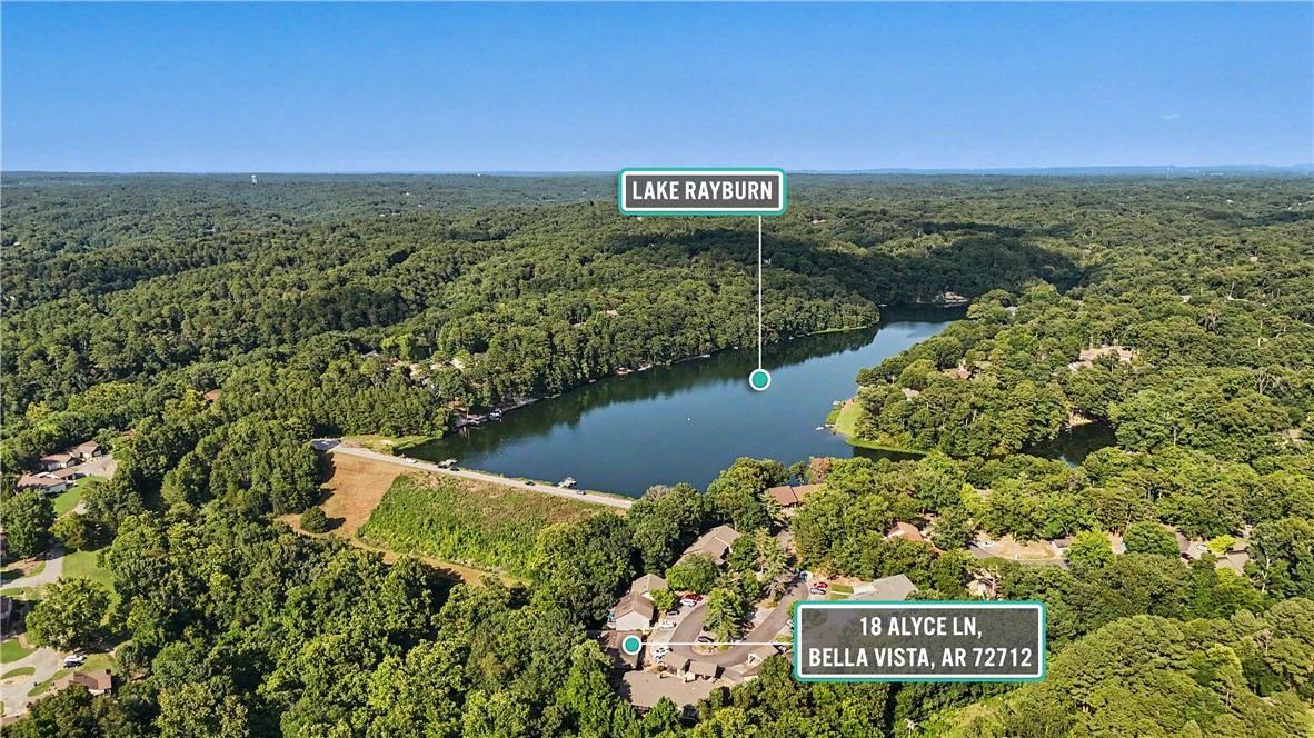 Whether you are searching for a primary residence, weekend retreat or investment opportunity The Treehouse Townhome is it!   Experience the perfect blend of comfort, convenience, and outdoor adventure in this beautifully updated Bella Vista Townhome just steps from Lake Rayburn and a natural waterfall.   Located minutes from the new OZ Trail Bike Park,  Northwest Arkansas' premier mountain biking/hiking trails, golf courses, parks and recreational amenities as well as quick access to I-49, downtown Bentonville, Crystal Bridges Museum, Walmart Home Office, Beaver Lake and XNA Airport.  This inviting 2 bed 2 bath home offers a spacious and functional layout featuring a king size primary suite, a comfortable guest bedroom, and a bright sunroom with peaceful treehouse views overlooking surrounding woods.   The well designed kitchen includes ample cabinetry, generous counter space and is open to main living area making it ideal for everyday living or hosting guests.  Don't miss the dedicated storage room below sunroom!