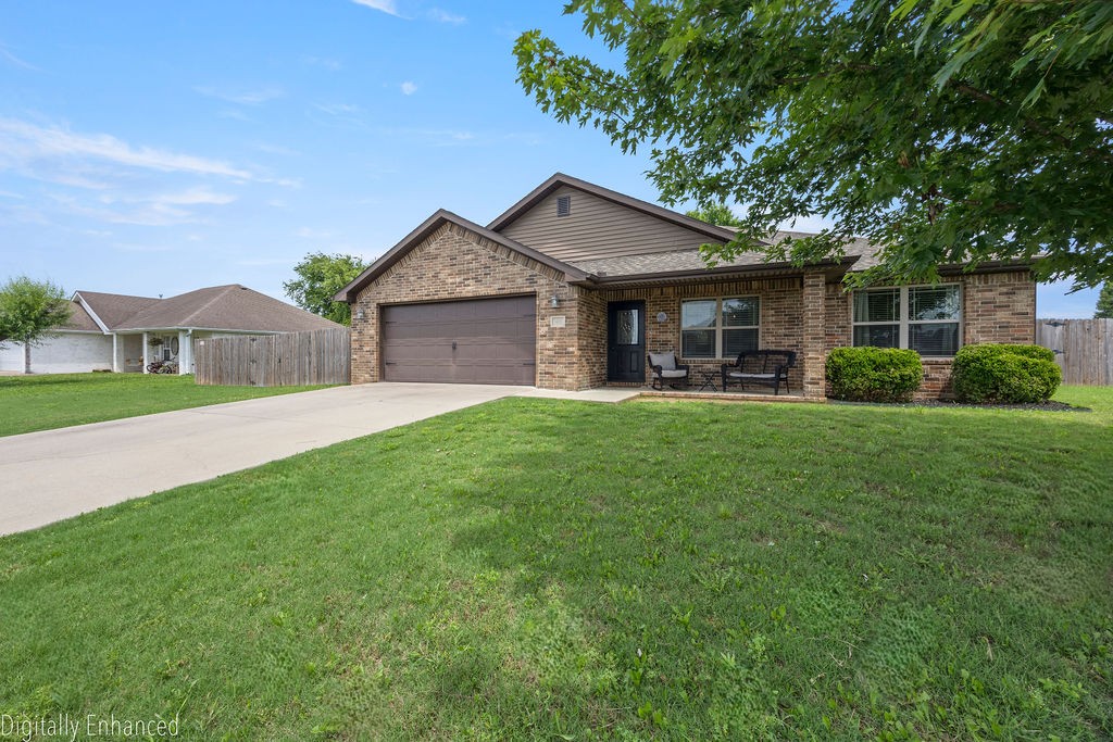 Charming home in Battle Field Estates! Bright open floor plan, designed perfectly for both seamless entertaining and cozy everyday living. Delightful eat-in kitchen is fully equipped with sleek stainless steel appliances and a convenient bar seating area—the perfect spot for your morning coffee, quick weeknight meals, or chatting with guests while cooking. Enjoy ultimate privacy with a floor plan that perfectly separates the primary suite from secondary bedrooms. Primary bedroom serves as a sanctuary, boasting elegant tray ceilings, dual sink vanity and a generous walk-in closet. Thoughtful storage spaces throughout. Fully fenced backyard and extended patio offers a private haven for kids and pets. Harnessing the power of the sun, this cozy home turns sunny days into lower electric bills. Established neighborhood is 5 mins away from Battlefield State Park and all Prairie Grove schools are less than 5 mins away. Muddy Fork Park with trails, playground and creek connect to the neighborhood. Must see this one today!