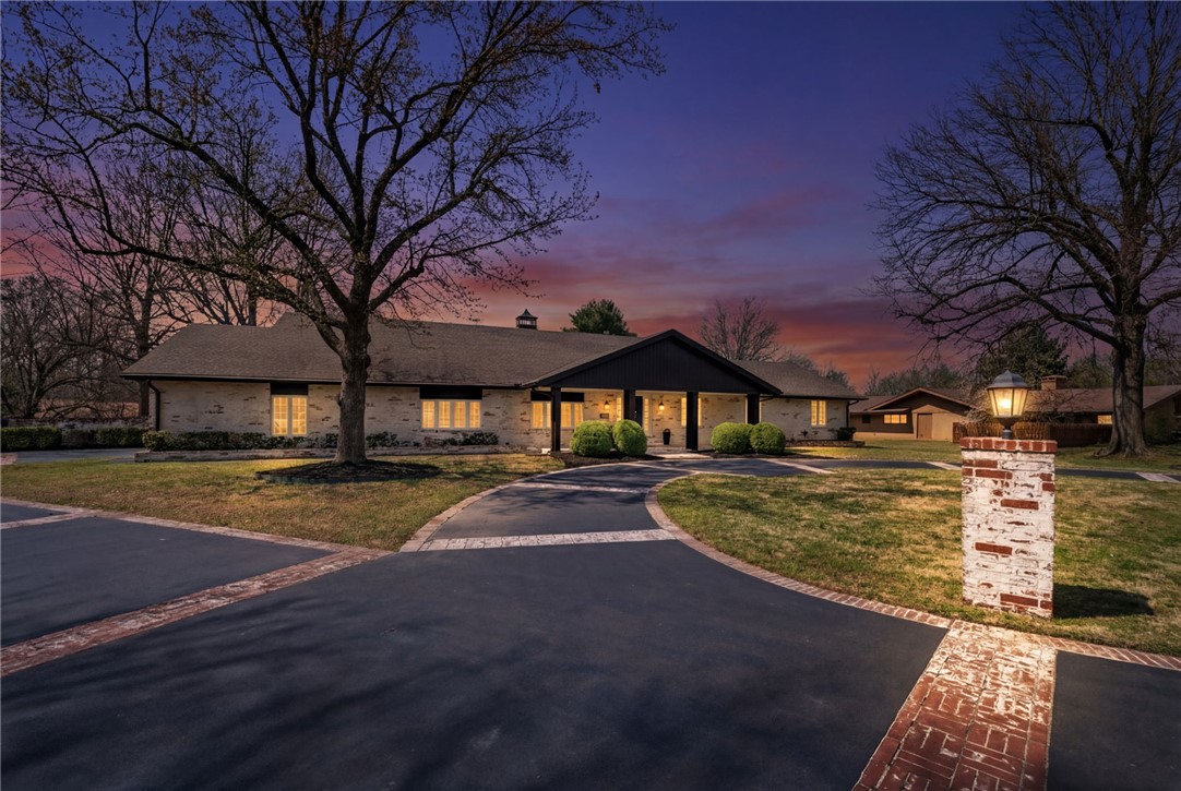 Welcome to a rare blend of historic charm and modern luxury in the heart of Springdale. This remodeled 5,300 sq ft home sits on nearly 3 acres within a subdivision, offering both privacy and convenience, while also being effortlessly accessible to JB Hunt Park, NWA Greenway bike trail, & less than 2 miles from downtown! Inside, you’ll find thoughtfully updated living spaces paired with timeless character, featuring a private movie theatre, indoor sauna, and multiple areas designed for entertaining. Step outside to your own resort-style retreat complete with an inground pool, hot tub, private pond, and a full tennis court, creating a lifestyle that’s hard to match. Whether hosting guests or enjoying quiet evenings at home, every detail of this property is designed for comfort, relaxation, and elevated living.