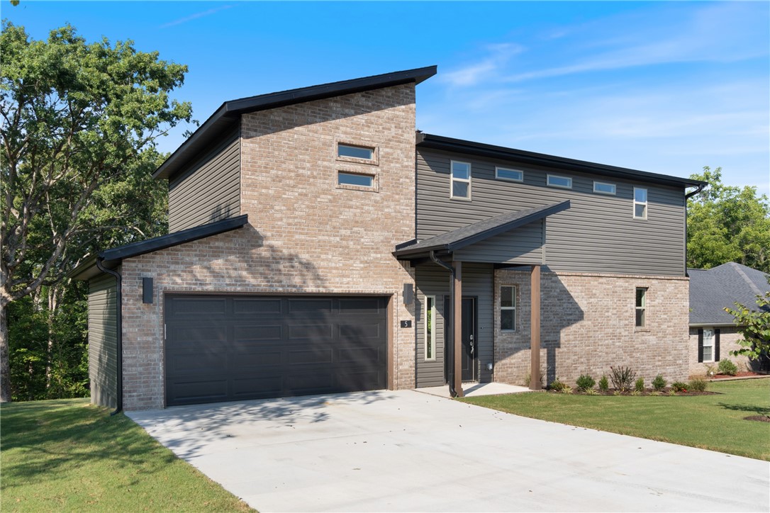 Welcome to this stylish new construction home offering 1,421 square feet, located in the desirable Highlands area of Bella Vista. This thoughtfully designed property features two spacious bedrooms with walk-in closets, 2.5 bathrooms, and a bright open-concept kitchen, dining, and living area. 2-car garage provides ample parking and storage and a great backyard with scenic view! Quality finishes throughout include 3cm granite countertops, LED disk lighting, a Frigidaire Gallery appliance package, and full aluminum guttering, offering both durability and modern appeal. Ideally situated near Lake Loch Lomond, popular bike trails, and just a short drive to downtown Bentonville, this home delivers an exceptional combination of comfort, style, and location.
