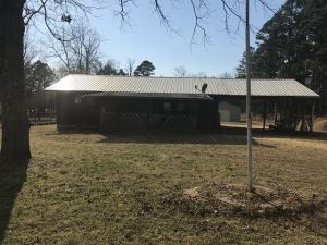 Looking for a place right on the lake?  Someplace to wet a hook or just relax and listen to the water?  This is for YOU!!  You can see lake from your backyard!!  Within walking distance to great fishing and recreation is where you will find this cozy 2 bedroom, 2 bath, nice enclosed back porch and large workshop is included!!Seller is Secretary of Veterans Affairs, seller does not pay customary closing cost or title policy, escrow fees, survey or transfer fees.  POF or Pre-qual dated 30 days or less required with offer.