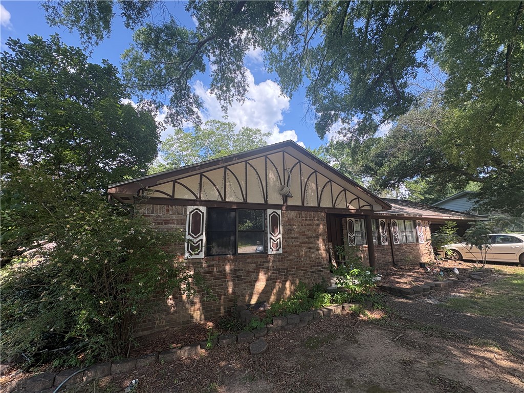 Investment opportunity in an established Russellville neighborhood! This 3 bedroom, 2 bath home offers approximately 1,937 square feet of living space, plus a heated and cooled sunroom that could provide an additional 486 sq ft of usable space. The home features a roof that was replaced in the last few years.
This property is in need of some updates, including flooring, interior doors and paint, and light fixtures making it an excellent opportunity for investors or buyers looking for a renovation project. With the right vision and improvements, this home has tremendous potential to add equity quickly.