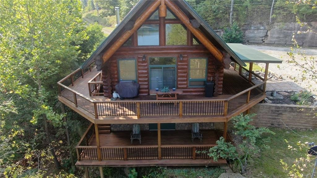 Fantastic Timber frame home on 18.11 lakefront acres. Home features 3bd, 2 ba, with lots of decks and a detached 2 car garage. Walk down to the water to swim or fish. Or take off in your boat from your boat slip with lift in the community boat dock which conveys with the property sale. The property is being offer at this price with all furniture and furnishings (with exception of personal items). With this being said, no moving needed. Just walk in and start enjoying your new lake home! The property also has other amazing building sights with incredible views of the lake as well, for future development if desired.