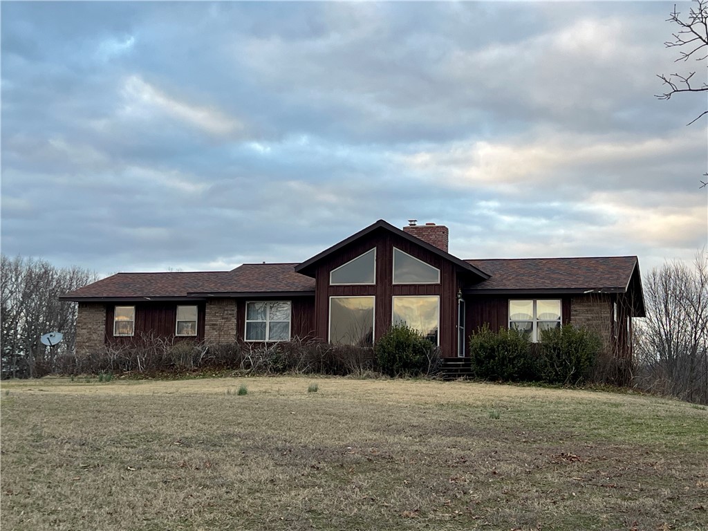 Ozark Mountain Views with a 3,014 SQFT home on 80 acres with 20 acres of prime hay-field pasture!! This 4BR-3BA home features a newly updated full basement, floor-to-ceiling living room windows, beautiful brick fireplace with wood stove insert, spacious screened in porch, efficiently designed galley kitchen, cathedral ceilings, walk-in closets, and wood stove in the basement.  The 80 acres features 2 fenced pasture areas, two ponds in the woods, and a large machine shed. Deer, bear, turkey, and elk have been seen on the property. Excellent hunting, seasonal creek, rolling topography, private location, and all home appliances and gun safe convey. Approximately 25 minutes into Harrison.