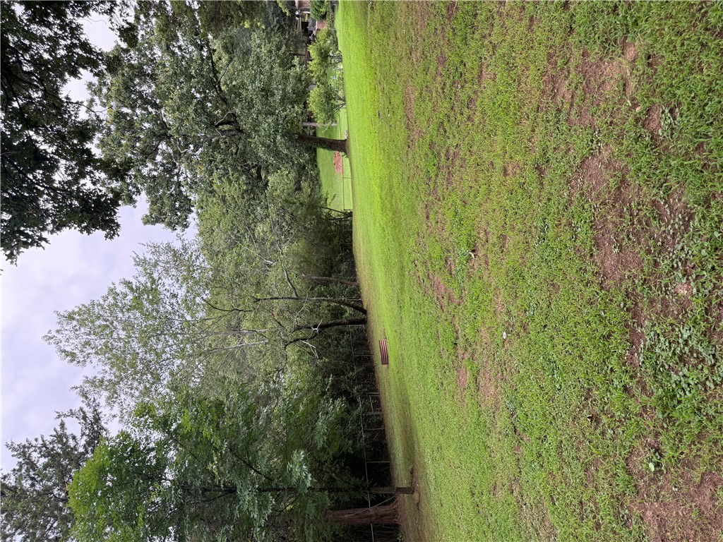 Huge Private backyard with Lots of Space for the kids to play, great garden area, or lots of space for entertaining! No neighbors in the back with lots of trees on the sides and back for PRIVACY!! Move in ready home as the current Owner has replaced the Roof, Installed New Flooring, & Totally Repainted the home! There is a huge Living area or game room that walks out to a nice deck overlooking the back yard and there is a heated and cooled walk-out basement for a workshop or extra living area Downstairs! Lots of great space for the money so don't miss this one!!
