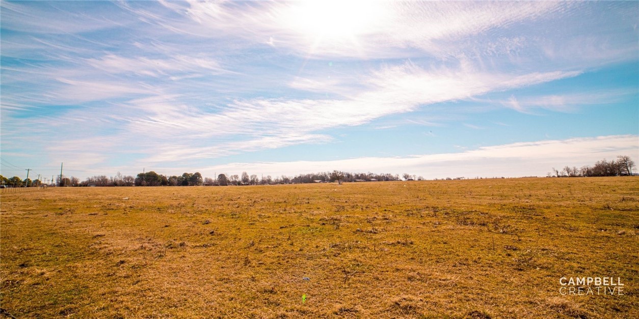 Great Development Potential, Listing includes 37+/- Acres of C-2 Zoned mostly level property.  Will divide with accepted offer in increments of 2 - 37 Acres.  Ideal for development of Retail Space, Neighborhood, Apartments, Professional Space, Entertainment, Dining. 
 The opportunities are endless.  1300 feet of frontage on W Pleasant Grove Rd, and 1200 feet of frontage on Concord St.  Formerly a grape vineyard and farm.  Includes two parcels with existing house and outbuildings.  Property is perfect location to capitalize on the extensive Professional, Retail and Food Service traffic in one of Northwest Arkansas prime business districts.  Close to shopping, dining, sports, entertainment, medical services, schools, financial center.  Go to video at following Link: https://vimeo.com/518353479