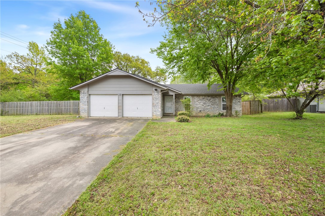 Location, location, location! Perfectly situated just one mile from Donald W. Reynolds Razorback Stadium and minutes from the University of Arkansas, this 3-bedroom, 2-bathroom home offers both convenience and comfort in a charming, established subdivision. 
Step inside to discover freshly polished concrete floors that add a modern, low maintenance touch throughout the home. The spacious living room features a vaulted ceiling, creating an open and airy atmosphere that's perfect for relaxing or entertaining. Natural light pours in through brand-new windows, all outfitted with blinds for privacy and efficiency. Other bonuses include new countertops throughout, a large fenced yard on a corner lot, and a newer roof (replaced in the last three years). Don't miss your opportunity to live close to everything Fayetteville has to offer while enjoying the charm of a quiet, lovely neighborhood. Also listed for lease. See MLS#1343111