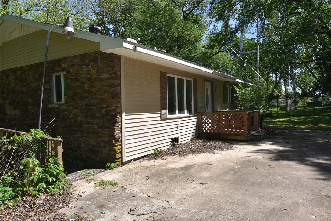 Located in the center of Pea Ridge, this property is close to every thing! Two lots included with (+/-) .68 acres of beautiful cleared land. A fixer upper waiting for some TLC! Would be great as an investment or rental. Snag this property today!