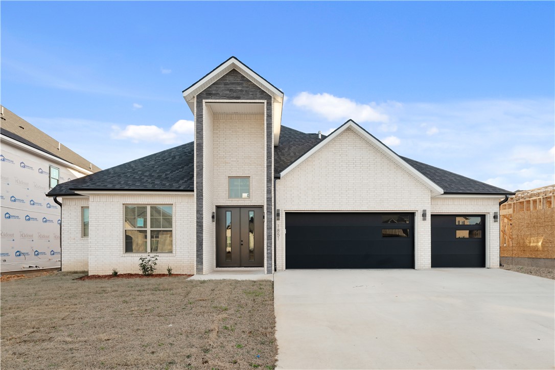 Welcome to 1851 Lotus Road in Silver Leaf Estates, a growing Centerton community with future access to a clubhouse, pool, fitness room, walking trails, and dog park. This spacious home offers three bedrooms on the main level, including a private primary suite with a spa-style bath, walk-in shower, soaking tub, and oversized closet. The living room features custom built-ins and a gas fireplace, opening to the kitchen with quartz countertops, custom cabinetry, large island, pantry, and designer lighting. Upstairs includes a large bonus room, additional bedroom, and full bath for flexible living space.