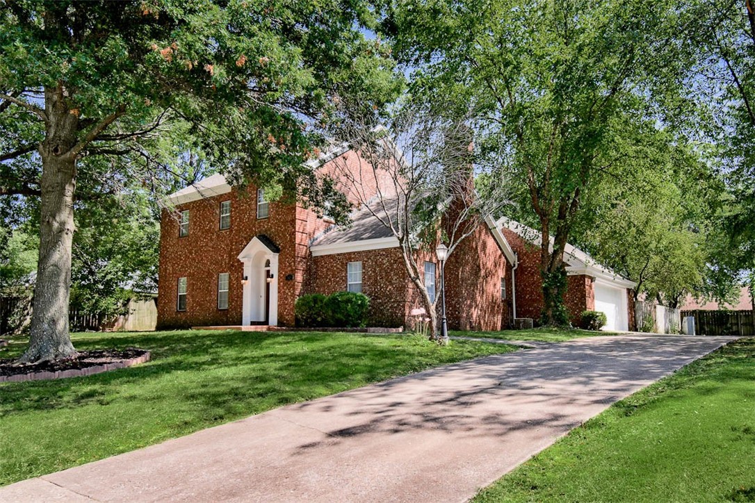 Welcome to one of the most unique, charming, character boasting homes in the neighborhood! Tall, towering brick surrounds this Chateau, that has been refreshed with new paint and a number of updates. Inside you will find windows all around, offering natural light that shines brightly on the wood flooring, as there is no carpet in this home! You can easily have 2 living rooms, a bonus room, den, etc. with this layout. Sellers are providing a Home Warranty which covers the systems of the home. This neighborhood offers one of the most beautiful drives, with well-kept homes and curb appeal from front to back. Fall in love with Chateau, and this Fall, enjoy the color changing of the mature trees that surround this home! The backyard setting offers space and serenity, enjoy the stone firepit at night! The location here is Fantastic! Less than 5 min. to I-49, restaurants, groceries, pool, Pinnacle Promenade, and last but not least near access to the Turtle Creek Bike Trail! We look forward to hosting You at 2610 Chateau!