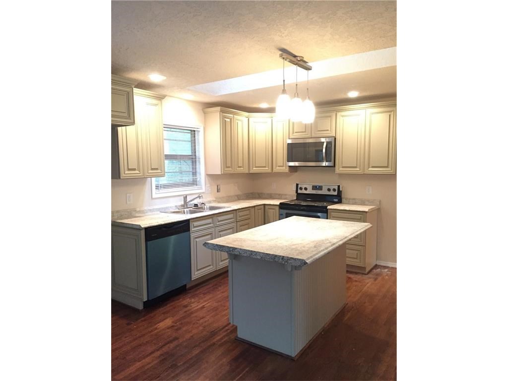 Stunning remodel in Bentonville School District! Property is practically new. Beautiful island with open concept to living space. New appliances, washer and dryer, light fixtures and more! Restored original hardwoods. Mature trees with a newly constructed deck to enjoy the sights and sounds of nature.