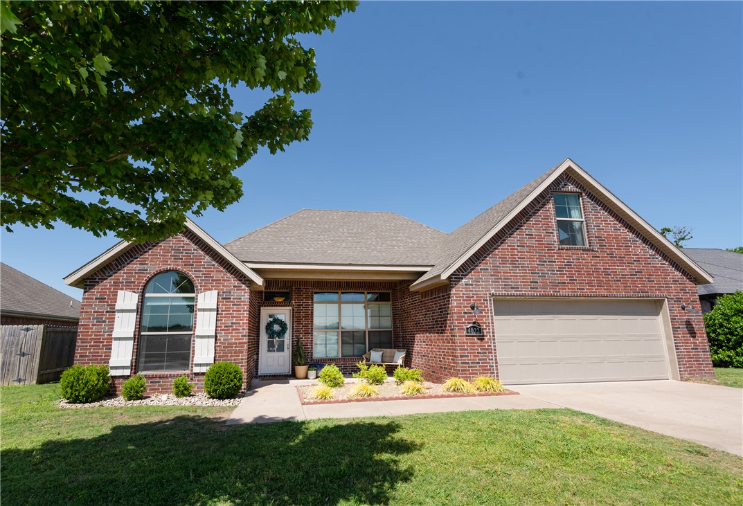 Beautiful home in one of the most convenient locations in all of NWA. 5 Beds, or 3 Beds with Office and Bonus Room. Open floor plan w/ eat-in kitchen, formal dining room, living room with cozy fireplace, spacious covered back patio, and private yard backing to woods. Featuring a split floor plan with vaulted primary suite complete with double sinks and large walk-in closet; Granite countertops, beautiful real wood and tile floors, crown moulding, and large windows. Brand new carpets in the bedrooms. This clean, well-maintained, pet-free and smoke-free home is move-in ready. Neighborhood amenities include a large pool and clubhouse, basketball court and baseball field. In addition, this home is an easy walk to the new Shaw Park, featuring 3 playgrounds, splash pad, walking trails, tennis & pickleball courts, and baseball fields. Centrally located in NWA with easy access to the 612 Bypass, I-49, and 112. Reach north Bentonville or south Fayetteville in under 20 minutes, and XNA is just a 12-minute drive.