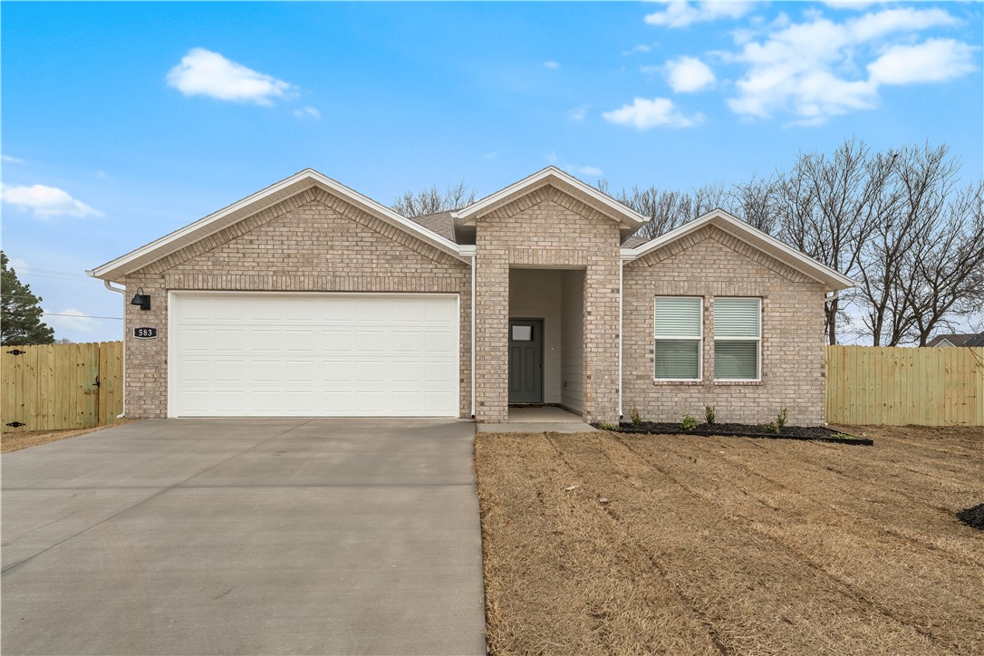 AVAILABLE 7/1/26! Beautiful home for rent in Wagon Wheel Crossing! This 4 bed, 2 bath home sits on a spacious 0.45-acre lot with a large, fully fenced backyard with lots of mature trees. Enjoy an open, airy layout with quartz countertops, stainless steel appliances & stylish finishes. This property is equipped with ceiling fans, keyless entry & smart home tech. Lots of additional storage & storage shelves in the 2 car garage. Fridge, washer & dryer provided. Attractions include Creekside Park, Lake Wilson trails, and quick access to downtown Farmington and Fayetteville has to offer. Located minutes from Farmington High School, Randall G. Lynch Middle School, the Razorback Greenway, and just 10 minutes to I-49 and 15 minutes to the University of Arkansas. Don’t wait - schedule your showing!