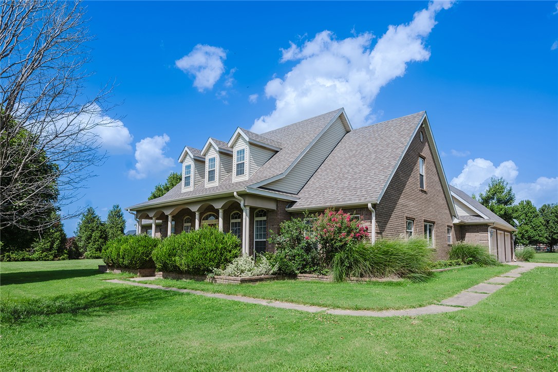 A spacious 3,584 sq ft, this single family home built in 2000 sits on a generous 3.28 acre lot. It features 4 beds, 4 baths, and a bonus room equipped for exercise. The large upstairs landing is spacious, versatile, and ready for you to make your own. The flat, open acreage provides a beautiful outdoor setting. A detached outbuilding adds valuable storage or work space.

The property offers convenient access to US HWY 412 through nearby Tontitown. Priced to reflect its size, features, and lot, this home presents an amazing opportunity for buyers seeking space & some fresh air. Schedule a showing to explore the possibilities!