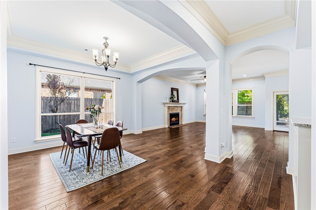 Rare opportunity to own a beautifully maintained home in Central Park! This gorgeous home offers the perfect blend of luxury, comfort, and functionality with a highly desirable mostly one-level layout & a large bonus room upstairs. Step inside to discover an open-concept floor plan filled with natural light, soaring ceilings, rich hardwood floors, & elegant finishes throughout. The kitchen features granite countertops, a large center island, walk-in pantry, abundant cabinetry that seamlessly flow into the spacious living & dining areas, ideal for entertaining & everyday living. The luxurious primary suite offers a spa-like bath with jetted tub, walk-in shower, & oversized closet. Enjoy year-round outdoor living on the screened-in porch overlooking the beautifully landscaped backyard & pergola patio. 3-car garage, fresh updates, ample storage, and prime access to top-rated Bentonville schools, biking trails, parks, the Bentonville Community Center, Walmart HQ, & Downtown!