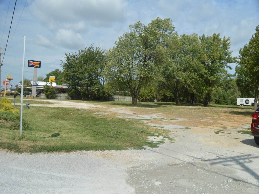 4.14 Acres! Great commercial exposure on Hwy 412 East next to Sonic. Acreage to the north would be ideal for office/warehouse development. Survey is available.