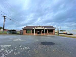 Location, Location, Location! 1,636 sq. Ft commercial, handicap accessible building right across from Walmart. 2 bathrooms one is handicap accessible and kitchen/break-room. With a Security system already installed just need to get it activated. Lots of protentional for a business opportunity waiting for your ideas. Side of building is fully fenced with a 2 car metal carport. Previously used as Watalula Water Users.
