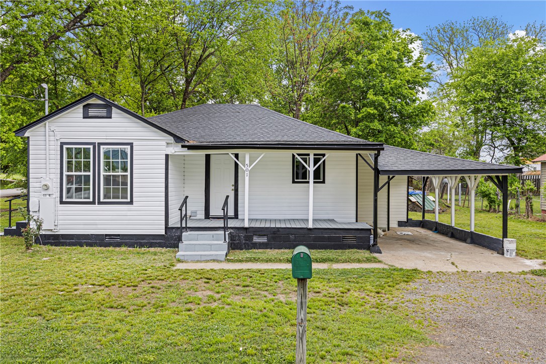 Charming 3-bedroom home on a desirable corner lot at 501 E 7th St, sitting on two city lots. Recently updated with new flooring, updated plumbing lines, and fresh interior paint, giving the home a clean, modern feel. Roof is only a few years old. Centrally located with easy access to local schools and the hospital. Book your showing