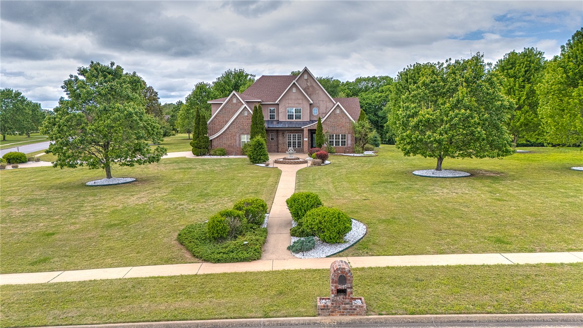 Stunning executive estate situated on approximately 1.52 acres in a desirable Fayetteville location offering privacy with convenience to shopping, dining, schools, and trails. This spacious home features 5 bedrooms, 3.5 baths, and well-designed living space. Freshly painted interior enhances the bright, updated feel throughout. Main level offers a luxurious primary suite plus bonus room ideal for office or secondary bedroom. Beautiful kitchen with oversized eat-in area, built-ins and abundant cabinetry. Upstairs includes additional 3 bedrooms, media/bonus room, Jack-and-Jill bath and additional bathroom. Enjoy elegant finishes, generous room sizes, and exceptional storage throughout. Room for a future pool.