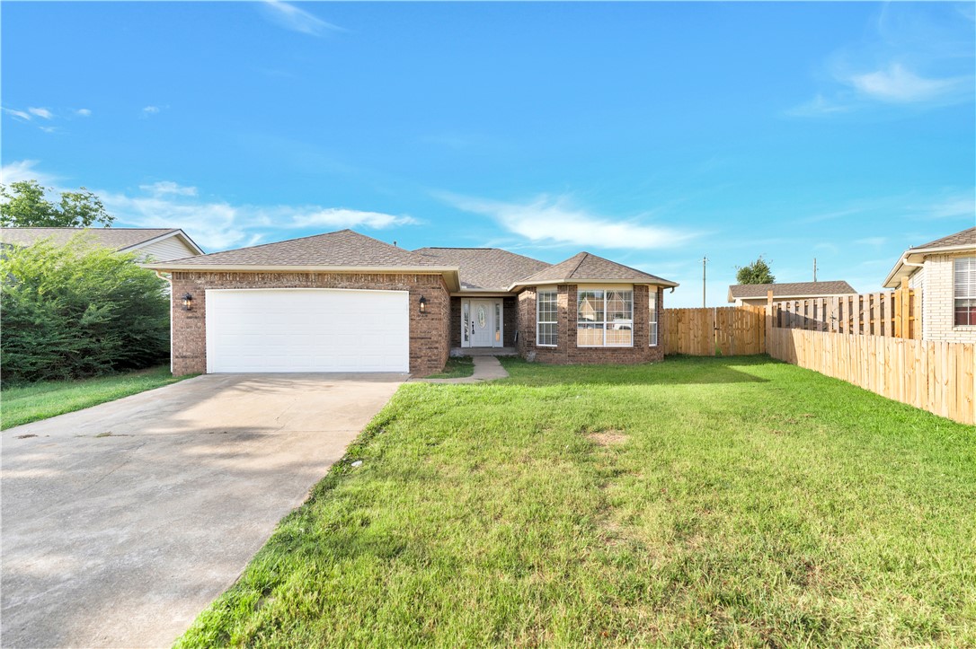 This beautiful 3-bedroom, 2-bath home offers 1,434 square feet of stylish living space in an established Rogers neighborhood. Recent updates include a new roof, new gutters, luxury vinyl plank flooring, updated fireplace, new cabinetry, quartz countertops, new interior doors, modern light fixtures, and fresh finishes throughout. The functional floor plan provides comfortable living, while built-ins and attic storage offer added convenience. Step outside to enjoy the spacious backyard, complete with a new privacy fence—perfect for entertaining, pets, or relaxing outdoors. Conveniently located near Westside Elementary School and just minutes from shopping, dining, parks, and everything Rogers has to offer. Don't miss your opportunity to own this beautifully updated home in a fantastic location!