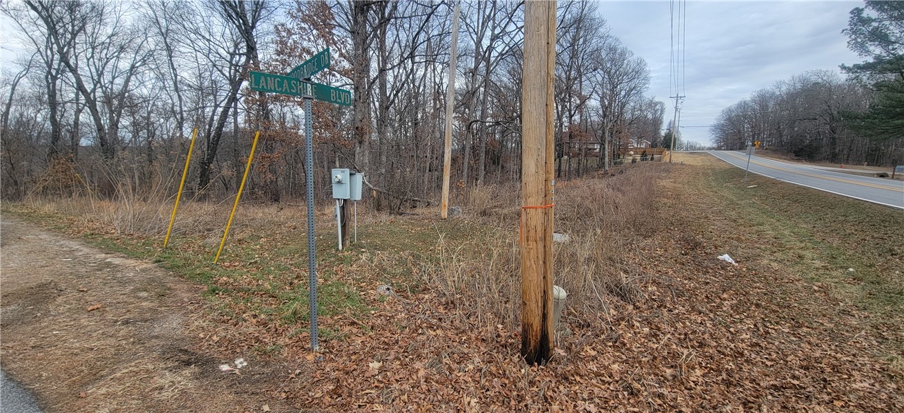 Two lots for the price of one! Side-by-side lots totaling 0.79 acres, corner lot ideal for a new home or investment property. Convenient access to Hwy 71 via Lancashire (south to I-49) or Hampstead (north to Walmart across the MO state line). Back 40 Trail access just 0.6 miles away and OZ Trails Bike Park only 5.5 miles. Metfield Recreation Area with pool, skate park, and tennis/pickleball courts is 3.7 miles away. Enjoy Bella Vista POA amenities including 7 lakes, 7 golf courses, indoor/outdoor pools, fitness centers, trails, and 100+ miles of mountain biking. Excellent opportunity to build or invest in a desirable location in Bella Vista.
