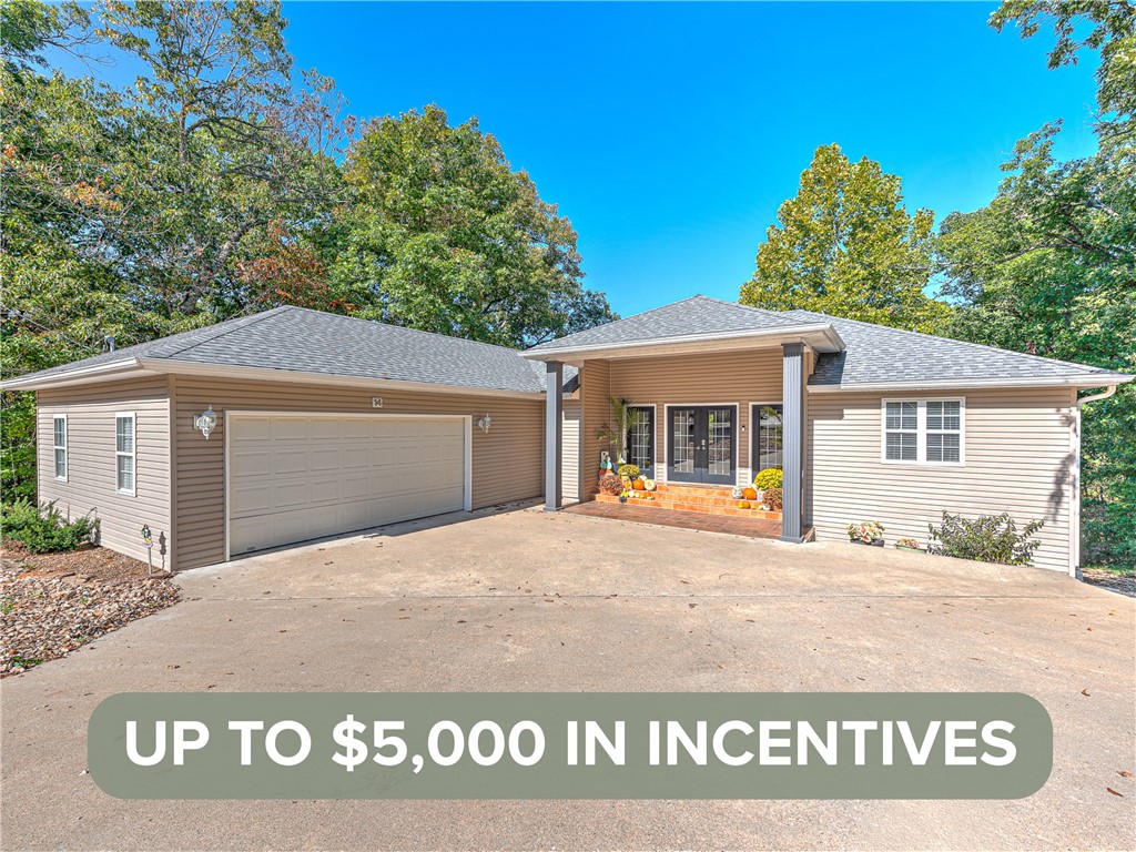 Now offering a $3,000 Preferred Lender Credit and a $2,000 Seller Credit. Welcome to this inviting Bella Vista home offering fresh updates, flexible living spaces, and a peaceful wooded setting. Located on a quiet street near Lake Ann, Lake Brittany, Pinyon Creek, and Flo Ride trails, this home delivers both comfort and lifestyle. The main level features a bright living area with vaulted ceilings, luxury vinyl flooring, three comfortable bedrooms, and two and a half updated baths.

The finished lower level adds incredible versatility with a large game room, second living area, custom bar, and a spacious bedroom with an ensuite bath, ideal for a second primary suite, guest space, or private in-law retreat. Enjoy two expansive levels of decking with wooded views, perfect for relaxing or entertaining. Additional highlights include fresh interior paint, smart thermostats, a roof installed in 2021, and updated HVAC units upstairs in 2021 and downstairs in 2024. A warm, welcoming home ready for its next chapter.