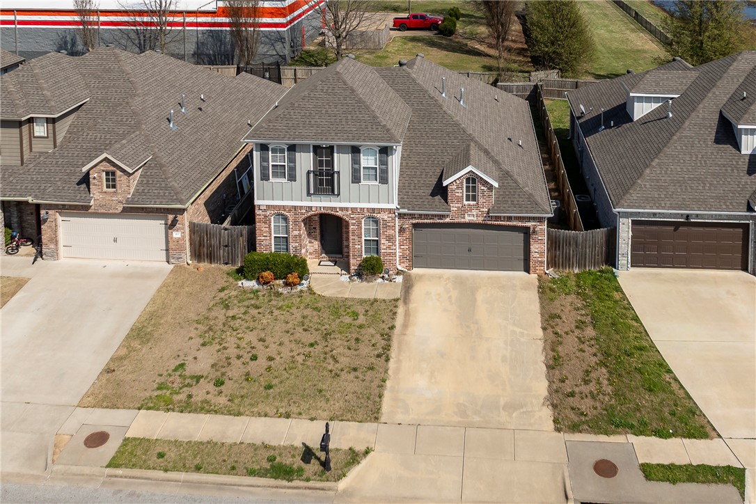 This 2019 built, 2,074sqft, 4-bedroom, 3-bath home located in the desirable Park Central Subdivision! This residence offers an open yet separate layout perfect for everyday living and entertaining. The kitchen features quartz countertops, black & stainless steel appliances, and a large bar top sitting overlooking the dining area with crown molding. It has wood floors, tile and carpet throughout. The main-level primary suite includes dual vanities, walk-in closet, and next-to direct laundry access, plus a second bedroom ideal for guests or an office, and built-in for coats/shoes/etc off garage. Upstairs offers two bedrooms and a full bath jack and jill style, and attic walk-in access for storage or seasonal items. Enjoy the covered patio, uncovered patio with basketball pole, no houses behind the fenced yard, and unbeatable location near I-49 (just minutes away from), schools, shopping, and Hwy-71 (just a minute away from). Check out the virtually staged photos. Move-in ready & designed for comfort and convenience!