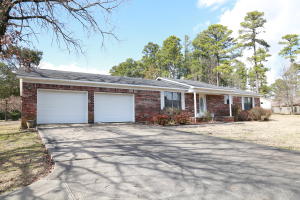 Spacious country addition, just minutes from shopping and the interstate.  This 3 bedroom, 2 bath home sits on approx 1.2 acres, on a corner lot.  The home features walk in closets , open dining, large living and a kitchen with lots of countertop space and cabinets.  Large laundry, covered patio and a oversized garage are just a few things.  One owner home, built with energy cost in mind.  Roof, water tank, and septic system, most flooring have all been updated in the last 5 years.  This home won't last long.