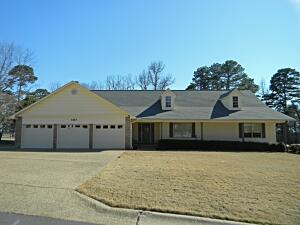 Location, location, location! This spacious 3 bedroom home in Western Russellville is a must see. This beautiful home offers a living room (currently used as a large formal dining) plus a large den with a fireplace and Country Flame insert. The kitchen has recent updates that include custom cabinets and custom designed shelving, tile backsplash, granite counters, and double ovens.  The spacious master suite boasts a huge bathroom with a walk-in tiled shower, soaking tub, and  a large walk-in closet. The unfinished basement is approximately 800 sq feet and is perfect for your hobbies, workshop, exercise area, or storage. Enjoy the privacy and scenic view from your large deck and covered sitting area (new composite decking recently installed). Come see today!