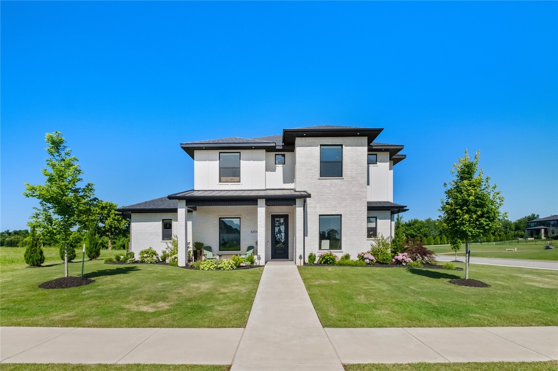 Elegant luxury meets thoughtful design in this executive home. The corner lot home in gated SV backs up to the 14th green & lake & is caddy corner to the 15th tee for views all around. The home is bright & airy with 43 windows & tall ceilings. The gourmet kitchen boasts Cafe appliances, quartz counters & display cabinets. Adjacent find a dry bar & butler pantry. Enjoy the primary suite with his & her designer closets, walk in shower & soaking tub. Rounding out the downstairs is a dining room with accent walls, custom office with privacy doors & open family room with a wall of glass windows/doors to enjoy the view. Upstairs find a bonus room with wet bar, 3 spacious bedrooms with Jack&Jill & ensuite designs. Enjoy  the expanded patio with gas FP overlooking park like landscaping and golf course views. 3-car garage with epoxy floors, security system, B'ville schools, & thoughtful storage are a few additional highlights. This home offers the best of luxury, function & location. Reach out for full features sheet.