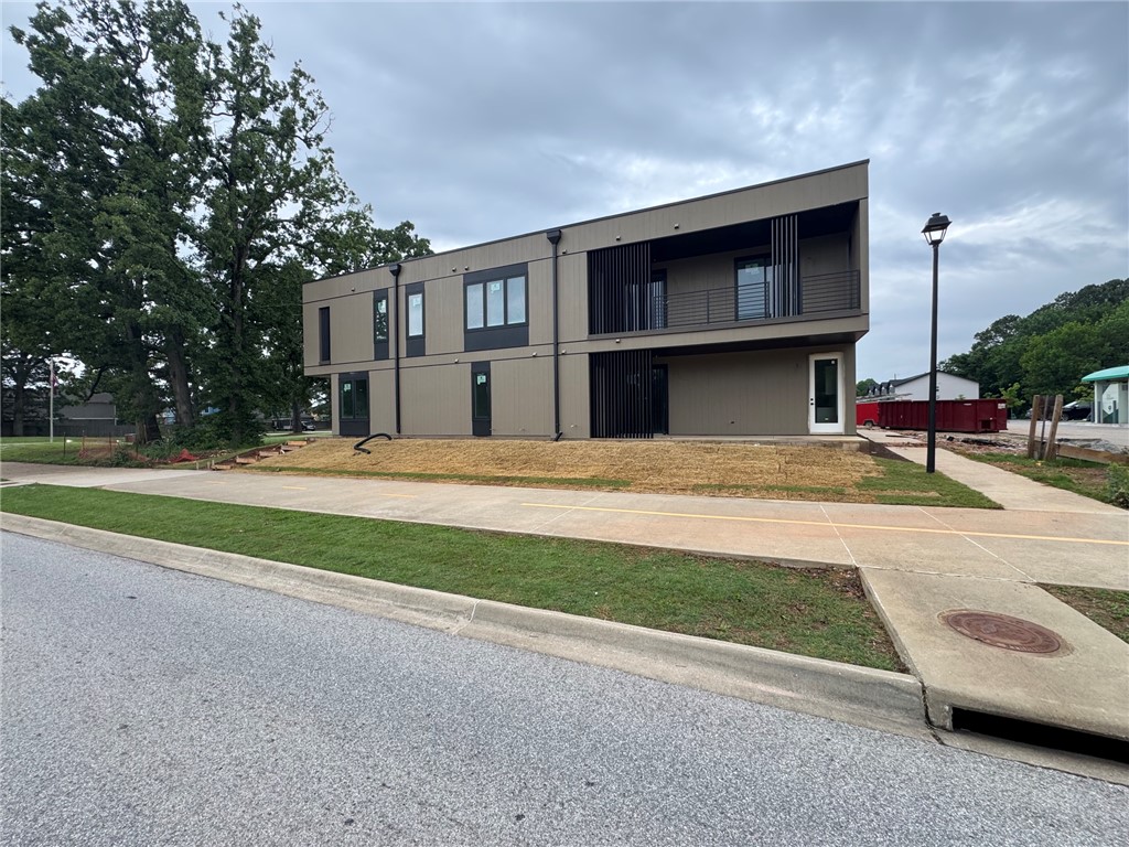Prime multifamily investment opportunity ideally located the center of one of Northwest Arkansas’ most dynamic and high-demand rental corridors.  Positioned on the U of A bus route and minutes from campus, dining, retail, bike trails and entertainment, the location offers unmatched convenience for students, professionals, and commuters. Easy access to I-49 provides seamless connectivity to Fayetteville, Springdale, Rogers, and Bentonville. This modern complex, built in 2026, showcases clean architectural lines and durable exterior finishes.  8 units in total, each with two bedrooms, two bathrooms a fully equipped kitchen, granite counter tops, luxury vinyl plank flooring, and covered balcony/patio space.  Taxes are estimated.
