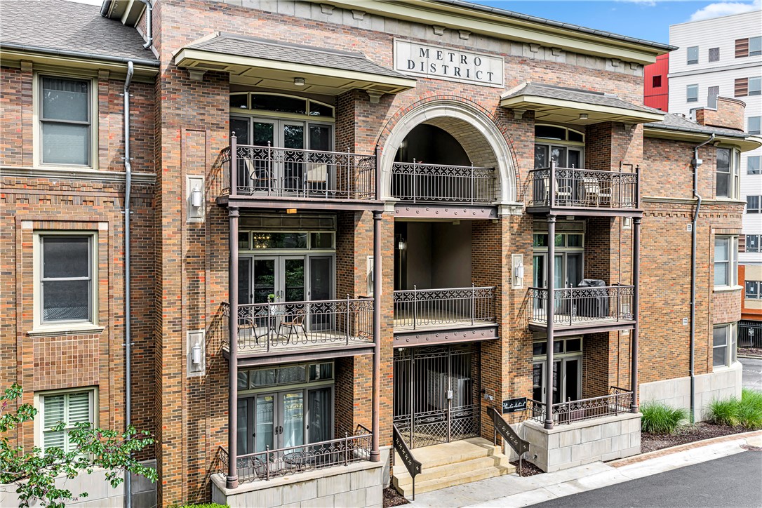 Fayetteville Entertainment District Condominium. One of the best condo locations in Fayetteville located adjacent to the Razorback Greenway and newly built Ramble Arts Corridor. This spacious 2 bedroom, 2 bathroom unit has a wonderful open living/kitchen area with a gas cooktop, electric stove, dishwasher and center island. The living area has a gas fireplace and opens onto the balcony on the west side of the building. The large primary bedroom has lots of windows providing natural light, a huge walk-in closet and ensuite bath with double vanities, walk-in shower and jetted tub. The unit comes with one dedicated parking space.