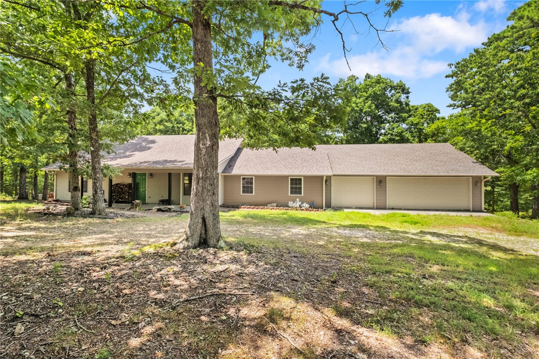 Your Private Northwest Arkansas Escape on 9.27 Acres! Where privacy, space, and the beauty of NWA come together. Situated on 9.27 picturesque acres, this 4 bed, 2 bath home offers the perfect opportunity to enjoy peaceful living while remaining just a short drive from the conveniences of Rogers and nearby Beaver Lake. Inside, you’ll find a comfortable layout with plenty of room for family, guests, or a home office. Whether you’ve been dreaming of creating your own outdoor oasis, or simply enjoying wide open spaces and the abundant wildlife, this acreage offers endless possibilities.
Sip your morning coffee while taking in the peaceful surroundings, spend your afternoons exploring your own property, and enjoy evenings under the Arkansas stars. 
If you’ve been searching for acreage, privacy, and the opportunity to make a property your own, this it it!