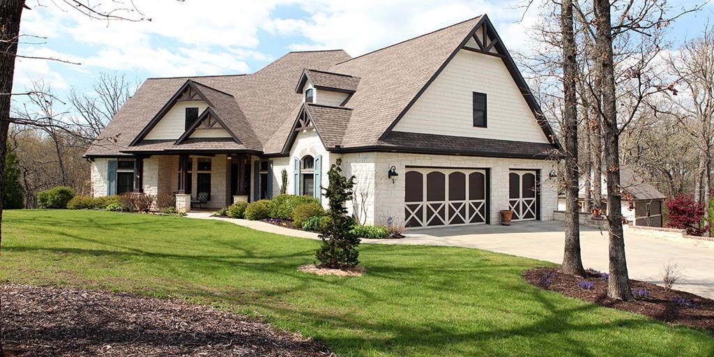 Stunning & custom built home on over 2 acres. It has a hint of Craftsman to the exterior and welcomes you inside with touches of French Country; including its rock fireplace, beautifully custom designed wood beams and a remarkable year round screened in porch with a wood burning fireplace to keep you cozy. The peaceful setting of this wooded lot with gently sloping hills surrounding and the landscaping that showcases each season will make you never want to leave home. The owners thought out every detail from custom built in's and cabinets, extensive crown molding and woodwork down to the composite windows for long term durability.