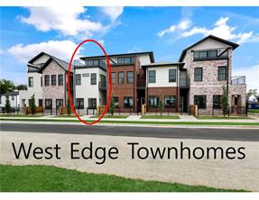 Embrace the vibrant Bentonville lifestyle at West Edge, townhome community where modern luxury meets unparalleled convenience. This exquisite 3-story unit, just one block from the highly anticipated STEM University (at the former Walmart Home Office site), offers a "modern classic" design aesthetic. Step inside to discover the elegance of white oak cabinets, premium white oak luxury vinyl flooring, and thoughtfully selected lighting. Large windows flood the space with natural light, complementing the impressive high ceilings. Outdoor living is a dream with a private, fenced front courtyard, a charming 2nd floor balcony, and a massive 3rd level party balcony – perfect for any occasion. The versatile top floor presents endless possibilities, whether you envision a spacious family room or a serene, spa-like primary retreat. Each bedroom has its own private full bath, ensuring ultimate comfort for all. This is more than a home; it's an invitation to live, love, and laugh in the dynamic heart of downtown Bentonville!