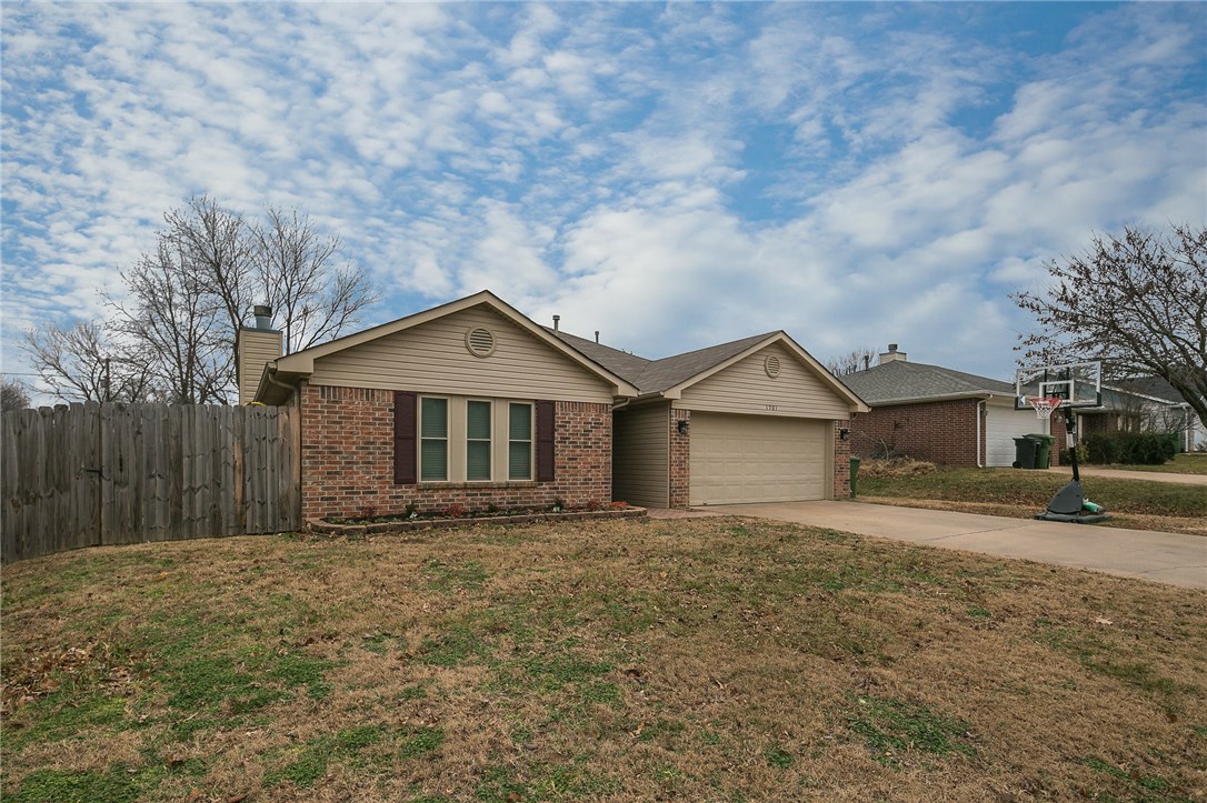 Beautiful home in a great Rogers neighborhood! 3BD/2BA, split floorplan, wood flooring in living room and carpet in bedrooms, gas starter fireplace, fenced in yard. Kitchen has white cabinetry and a pass-through to the living room. Enjoy your time on the porch in the nice backyard that has a storage shed and wooden play set that conveys. Don't miss this great deal! It won't last long.