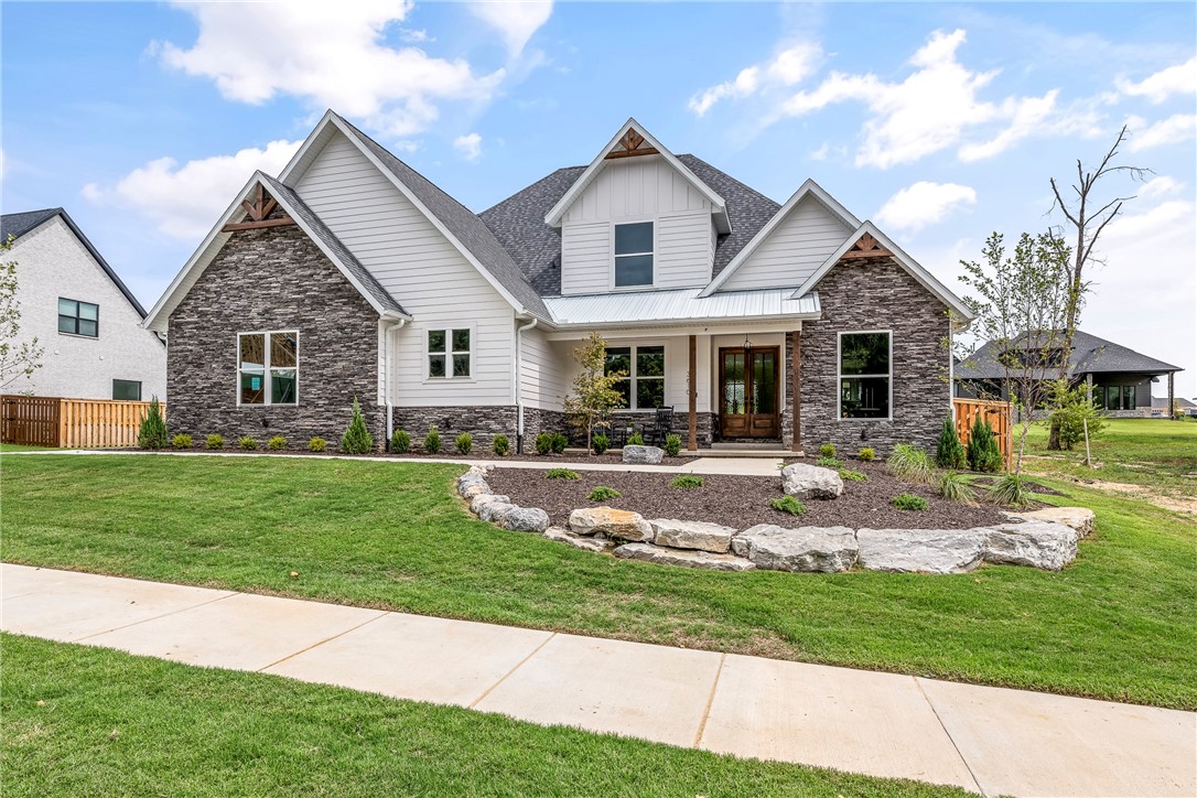 Stunning New Construction with a Best-Selling Floorplan in the sought after Big Sky Subdivision! All the quality and extras you expect throughout from one of the top builders in NW Arkansas. Large light-filled open living space featuring a gourmet kitchen with huge island, tons of cabinets, double ovens, gas cook-top and butler’s pantry. Downstairs also features the Master suite, formal dining, office or optional 5th bedroom. Upstairs features 3BRS, 2BA and large media/game room with built-in wet bar. Covered back patio fenced yard, complete home security system and smart home wired. Professionally landscaped, sodded yard and sprinkler system. Home is complete and move in ready! No time to wait!