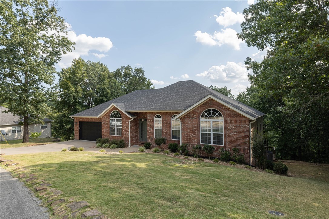 $10,000 in SELLER CREDITS. Use for rate buy down, deck upgrades, or buyer's choice! Well-maintained home with 2 spacious PRIMARY SUITES overlooking treehouse views on .55 acre lot less than 2 miles from Blowing Springs Trail Head, just behind Cooper Elementary, Mercy Hospital, and close access to Mighty Pine Trail. Features include new carpet, fresh paint (Repose Gray), new lighting & ceiling fans, crown molding, gas fireplace, wood flooring, and 13' ceilings. The kitchen contains an abundance of cabinet storage, double ovens, glass stove cooktop, & new oversized picture window in eat-in kitchen. The 2 split-plan primary suites both have direct deck access. Main level features large formal dining, a study, 3 bedrooms, laundry with utility sink. Lower level has one bedroom, bonus space, study, half bath, home gym, & ample storage. New basement flooring, Roof 2023. New sliding doors in living & second primary.   A must see!